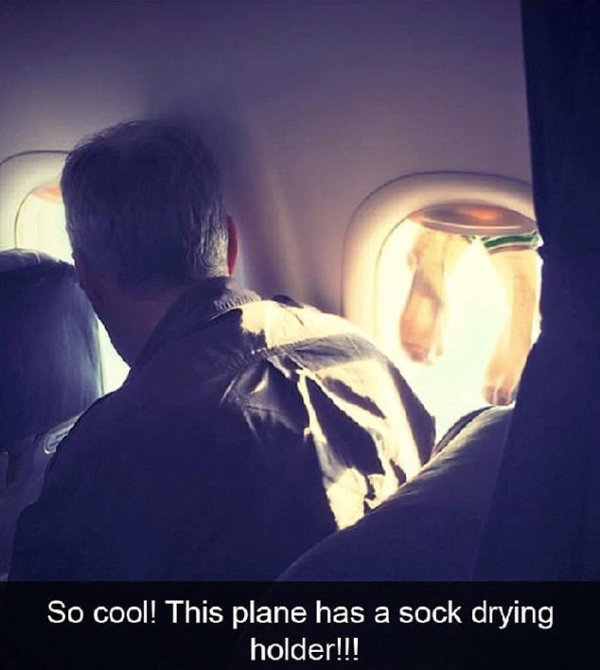 disgusting passenger caught drying his socks - So cool! This plane has a sock drying holder!!!