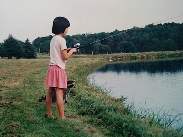 girl fishing raccoon