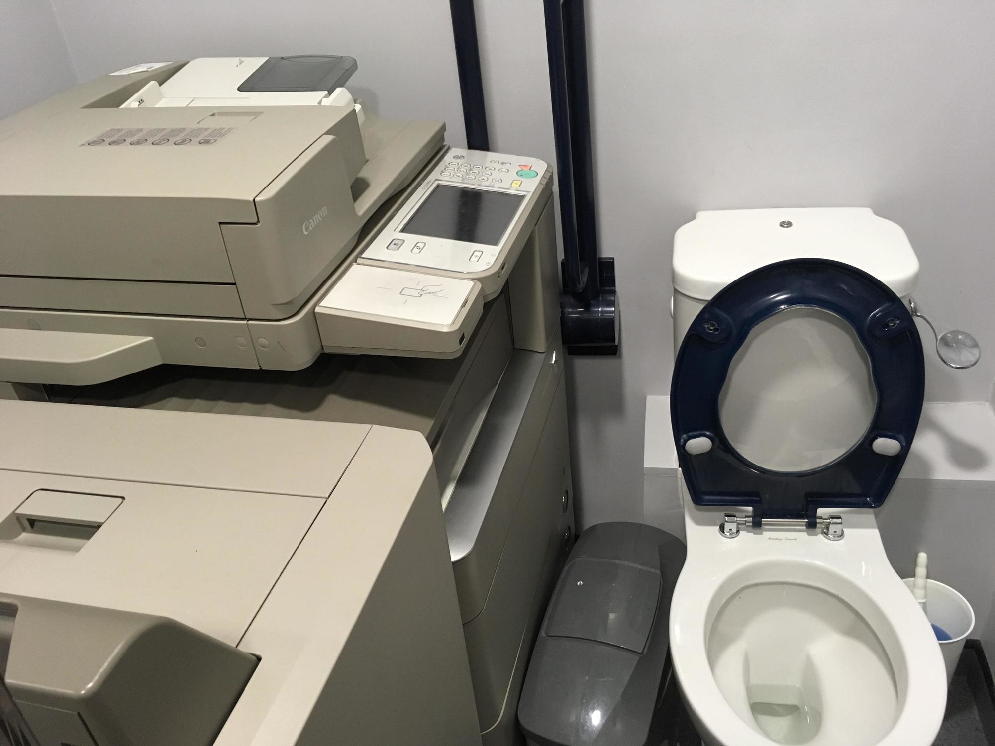 toilet next to the copy machine.