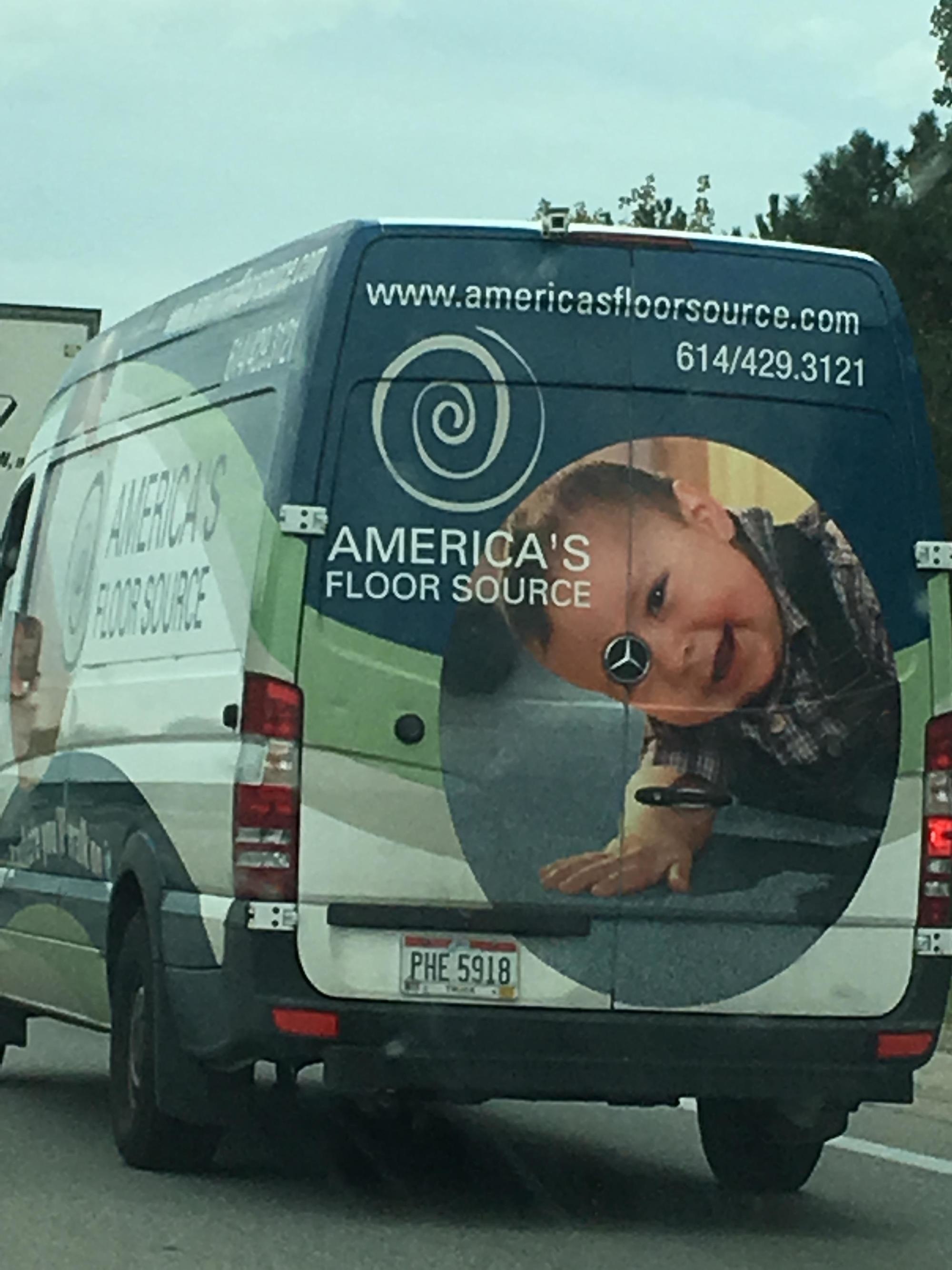 Kid on the back of a van with Mercedes logo right on his eye.