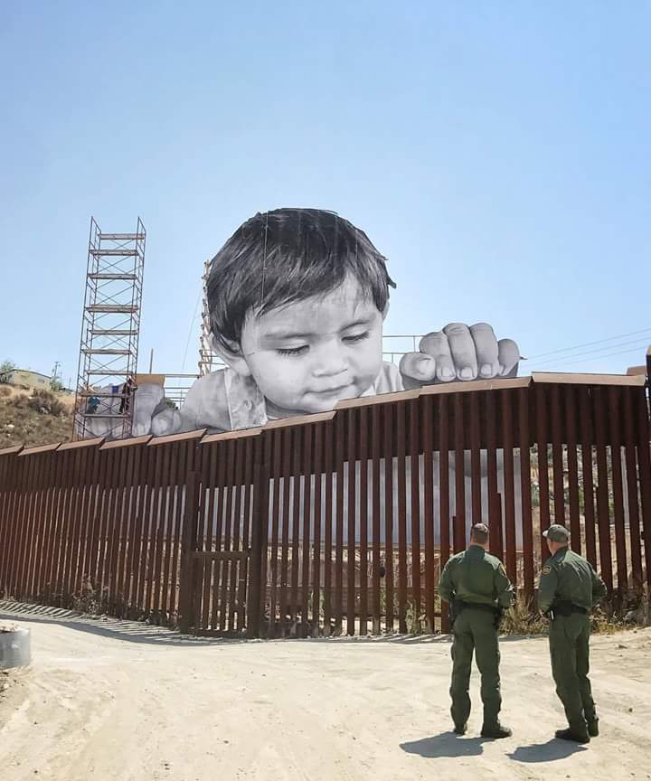 Artwork of a kid reaching over the US/Mexican wall