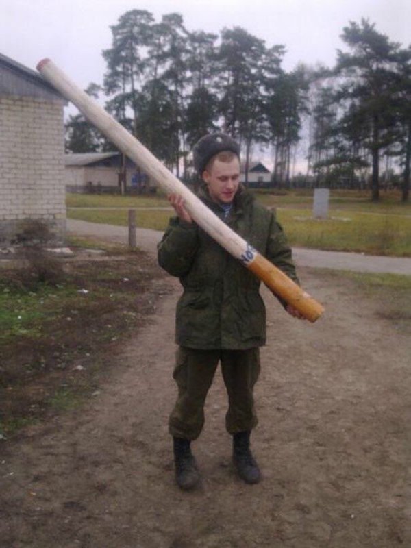 Russian Soldier holding a massive cigarette.