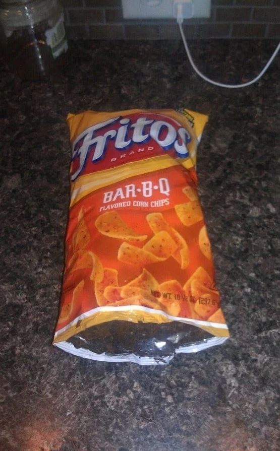 Upsidedown opened bag of Fritos Bar B Q