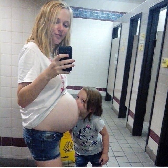 mom using bathroom selfie