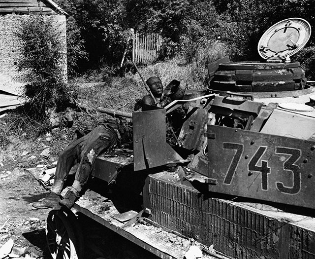 Burnt out Panzer IV and crew during the Battle of the Falaise Pocket, August 1944
