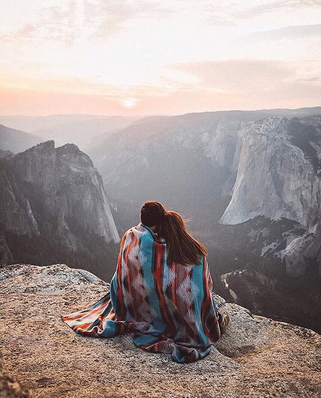 Couple sharing a blanket and beautiful view