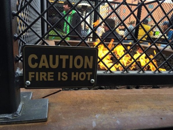signs that humans are getting dumber - Caution Fire Is Hot