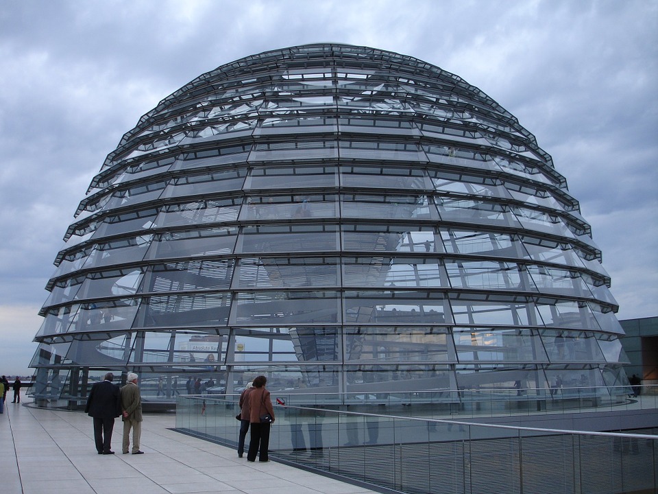 The German Parliament building has a glass dome above it that people can climb using a spiral ramp. The dome symbolizes that the people are above the government, and the government should be transparent.