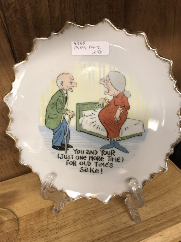 Plate at thrift shop with funny comic on it.