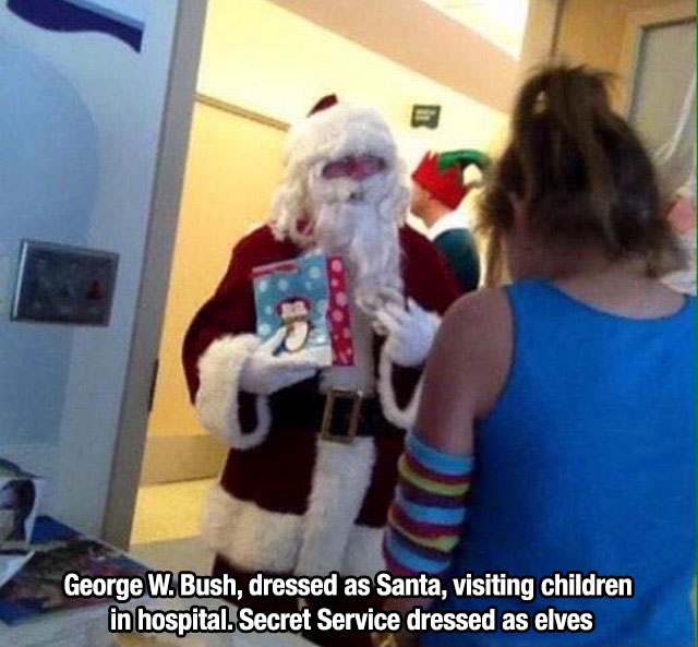 george bush santa claus secret service as elves - George W. Bush, dressed as Santa, visiting children in hospital. Secret Service dressed as elves
