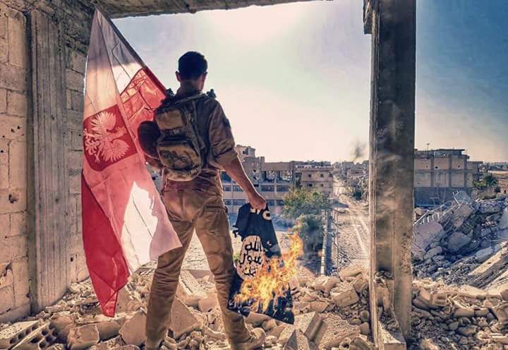 Polish soldier burning an ISIS flag in Syria