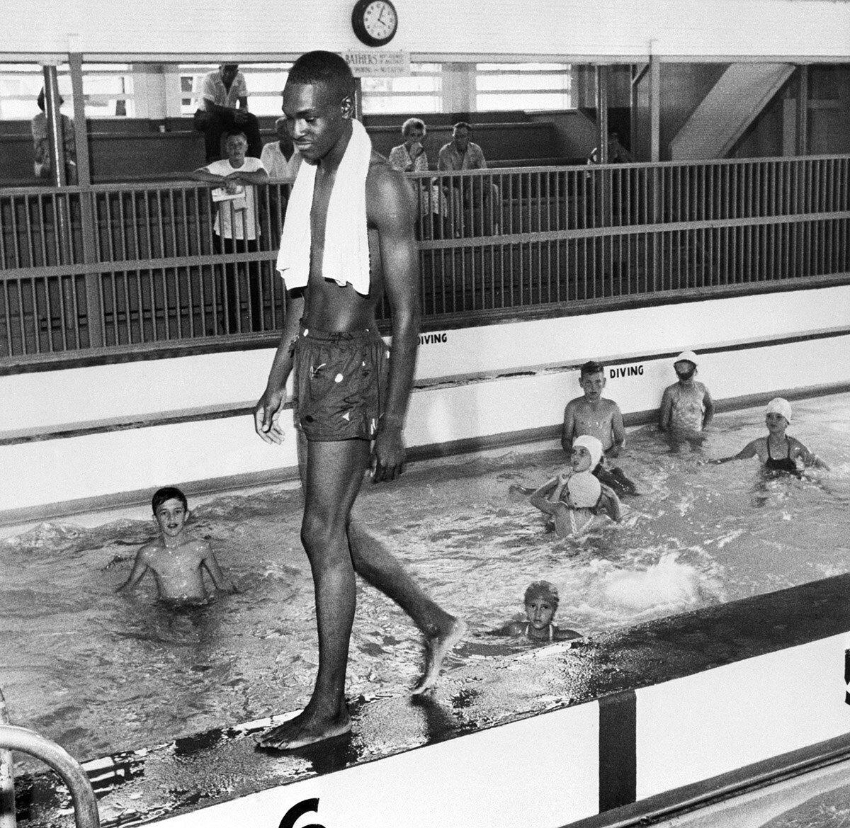 David Isom, 19 years old, bravely broke the color line in a segregated pool in Florida on June 8, 1958, which resulted in officials closing the facility.