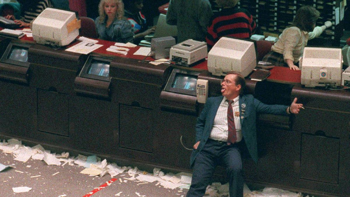 An exhausted trader at the end of the worst day in stock market history, “Black Monday”, October 19, 1987. After “Black Monday”, stock exchanges instituted circuit breakers, or trading pauses, when there are large declines.