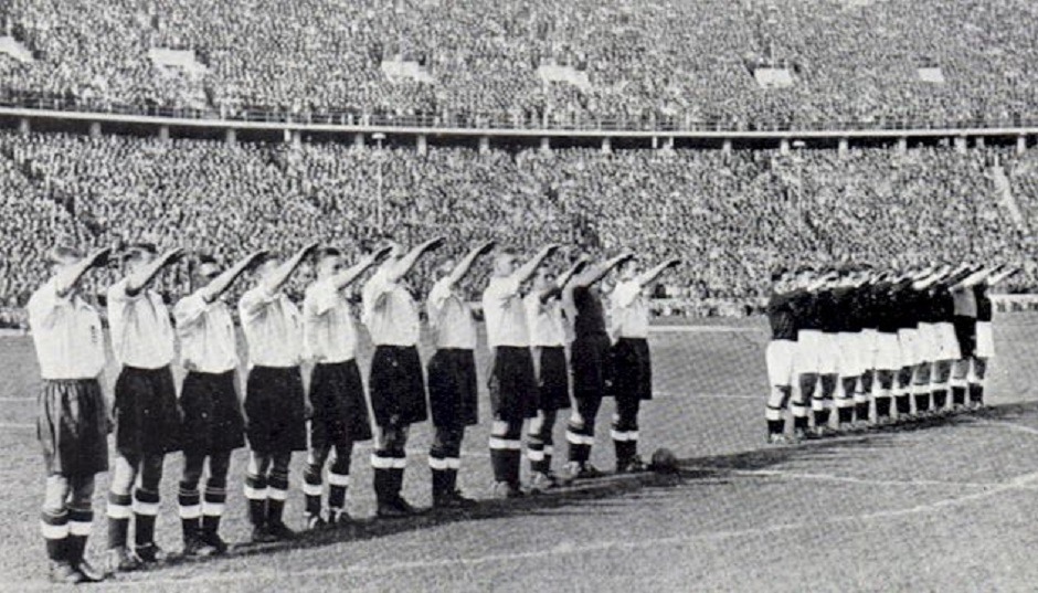 The English football team give the Nazi salute in front of 110,000 spectators, including Goering, Hess and Goebbels, ahead of their game against Germany at the Olympiastadion, Berlin. May, 1938