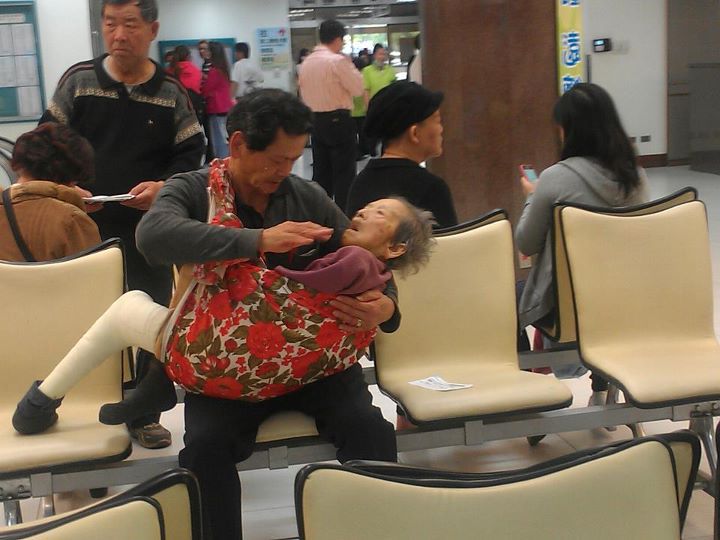 A son caring for his elderly mother