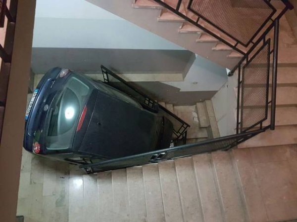car driving down stairs