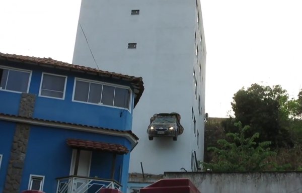 car drives through house