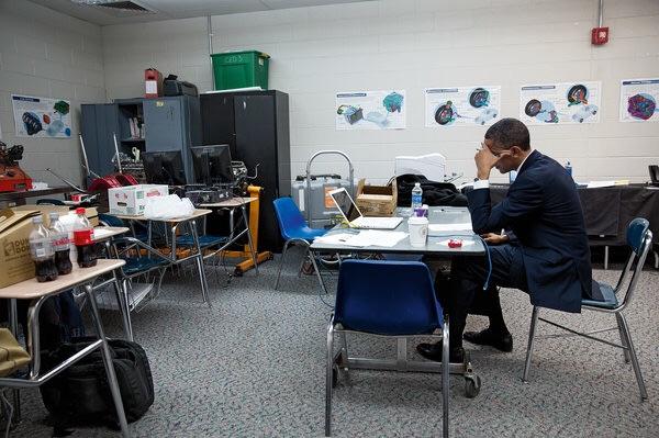 Obama sits alone in a classroom rewriting his remarks before speaking at the memorial service for victims of the Sandy Hook Elementary School shooting. Taken 2 days after the shooting on Dec. 12, 2012