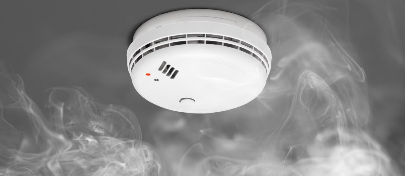 Not sure if this is a feature on all smoke detectors, but finally after five years of owning my house and getting used to grabbing a chair and knocking the batteries out of it, I just hit the test button on the front when it went off while cooking. "Hush mode activated". It turns it off for fifteen minutes and automatically turns itself back on. It felt like unlocking a secret character in mortal kombat.