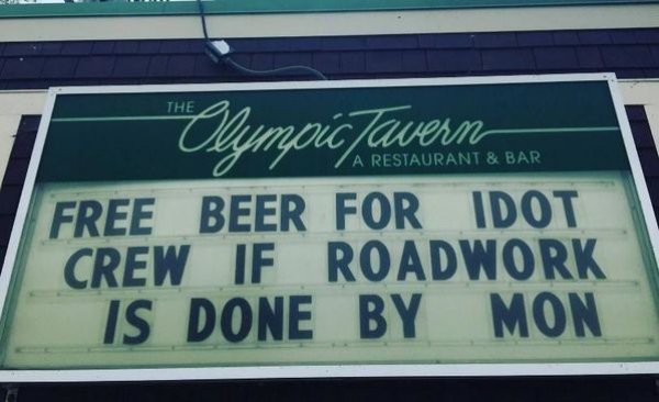 street sign - The Za Restaurant & Bar Olympic Tavern Free Beer For Idot Crew If Roadwork Is Done By Mon