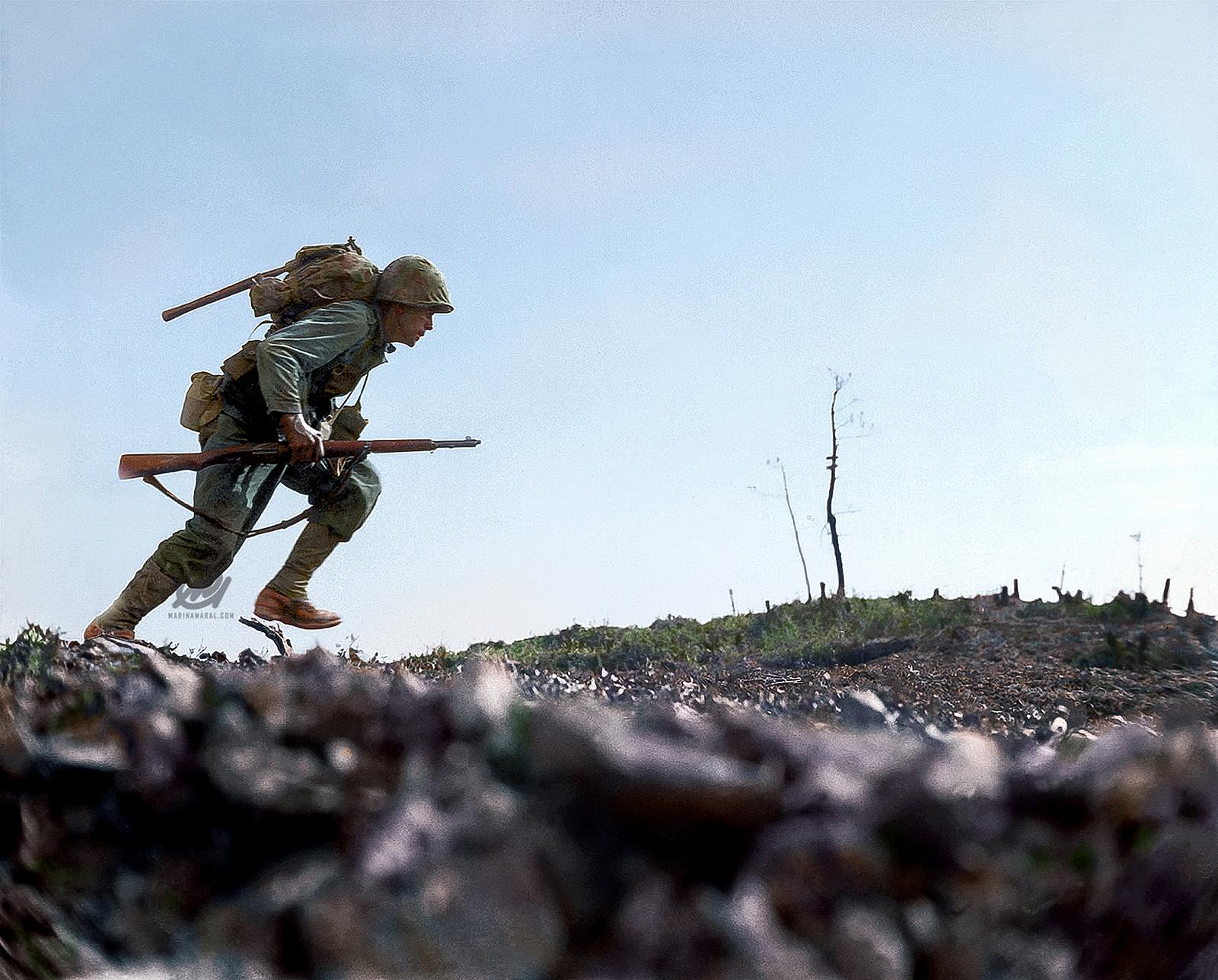 US Marine running through Japanese fire on Okinawa, Japan, 7 Jun 1945