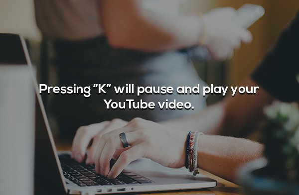 Pressing "K" will pause and play your YouTube video.