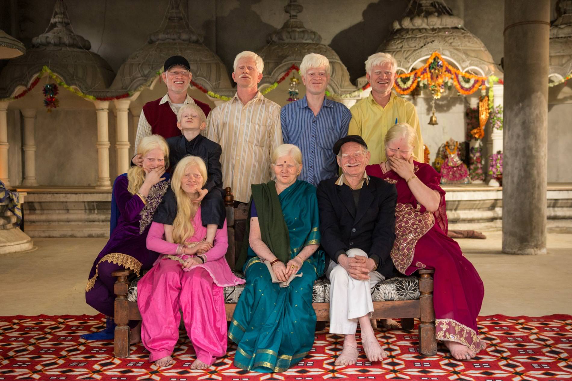 At a Hindu temple near their home in Delhi, India, three generations of a family with albinism pose for a rare family portrait