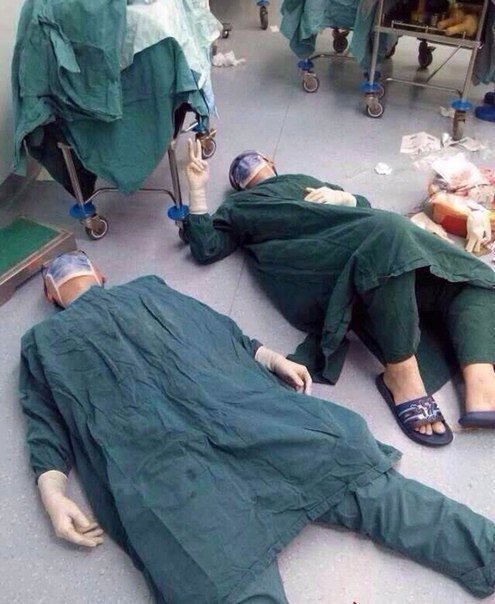 2 surgeons after successfully removing a set of brain tumors during a 32 hour surgery