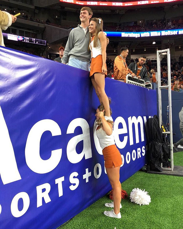 cheerleader helping a friend out