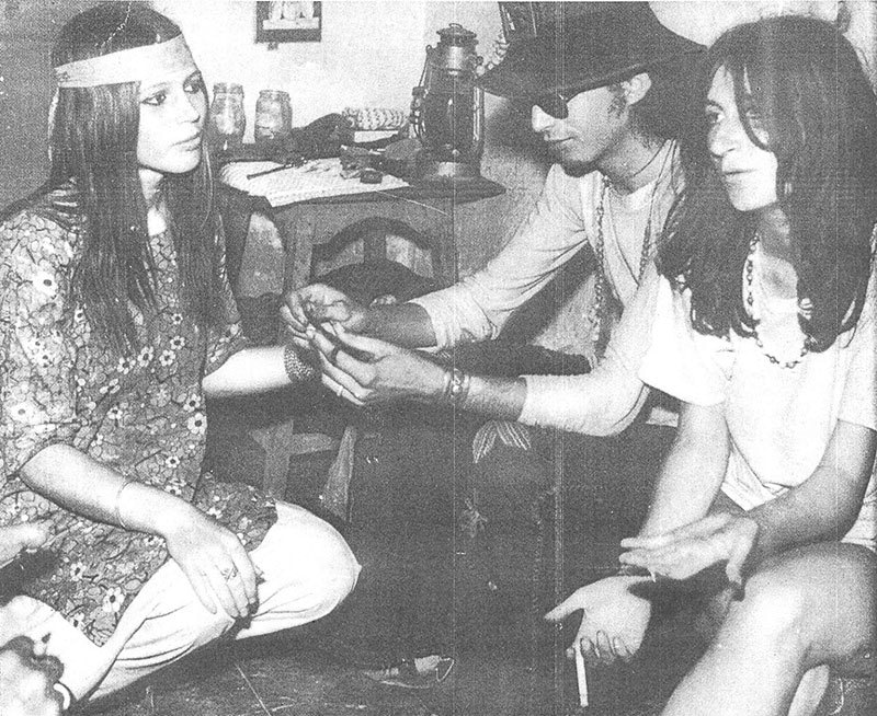 Pakistani hippies rolling up a joint in Karachi, 1973