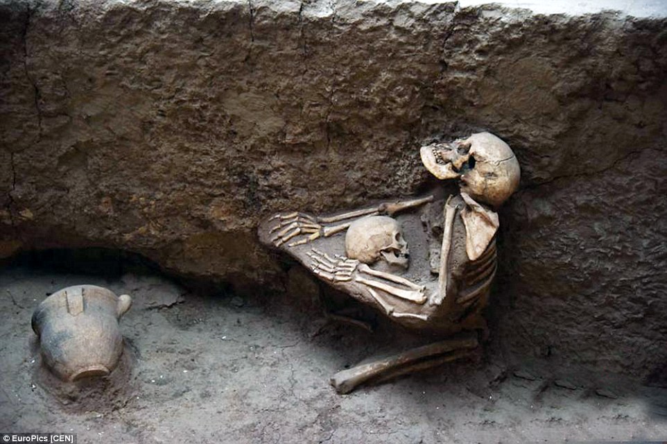 The final embrace… a woman protecting and comforting a child during an earthquake which caused the nearby river to overflow and bury the village in dirt and debris, Lajia Ruins Museum, China