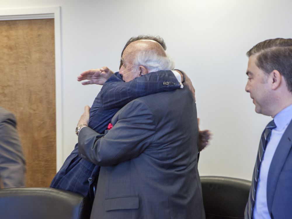 This photo, of Secretary of Energy Rick Perry embracing Robert Murray, CEO of one of the country’s largest mining companies, got an official government photographer fired
