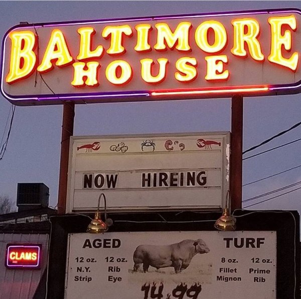 signage - Baltimore Khouse Now Hireing Turf Clams Aged 12 oz. 12 oz. N.Y. Rib Strip Eye 8 oz. Fillet Mignon 12 oz. Prime Rib 14.00