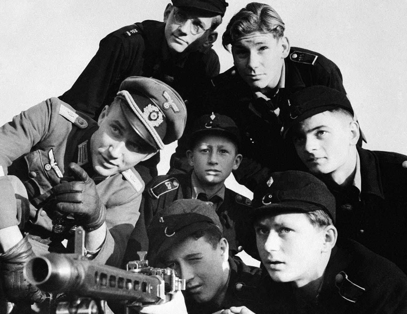 A group of Hitler youth receive instruction in the use of a machine-gun, somewhere in Germany, on December 27, 1944. Look at how young those kids are!