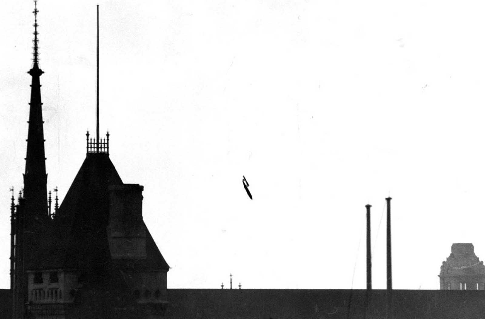 Across the Channel, Britain was being struck by continual bombardment by thousands of V-1 and V-2 bombs launched from German-controlled territory. This photo, taken from a fleet street roof-top, shows a V-1 flying bomb “buzzbomb” plunging toward central London. The distinctive sky-line of London’s law-courts clearly locates the scene of the incident. Falling on a side road off Drury Lane, this bomb blasted several buildings, including the office of the Daily Herald. The last enemy action of British soil was a V-1 attack that struck Datchworth in Hertfordshire, on March 29 1945.
