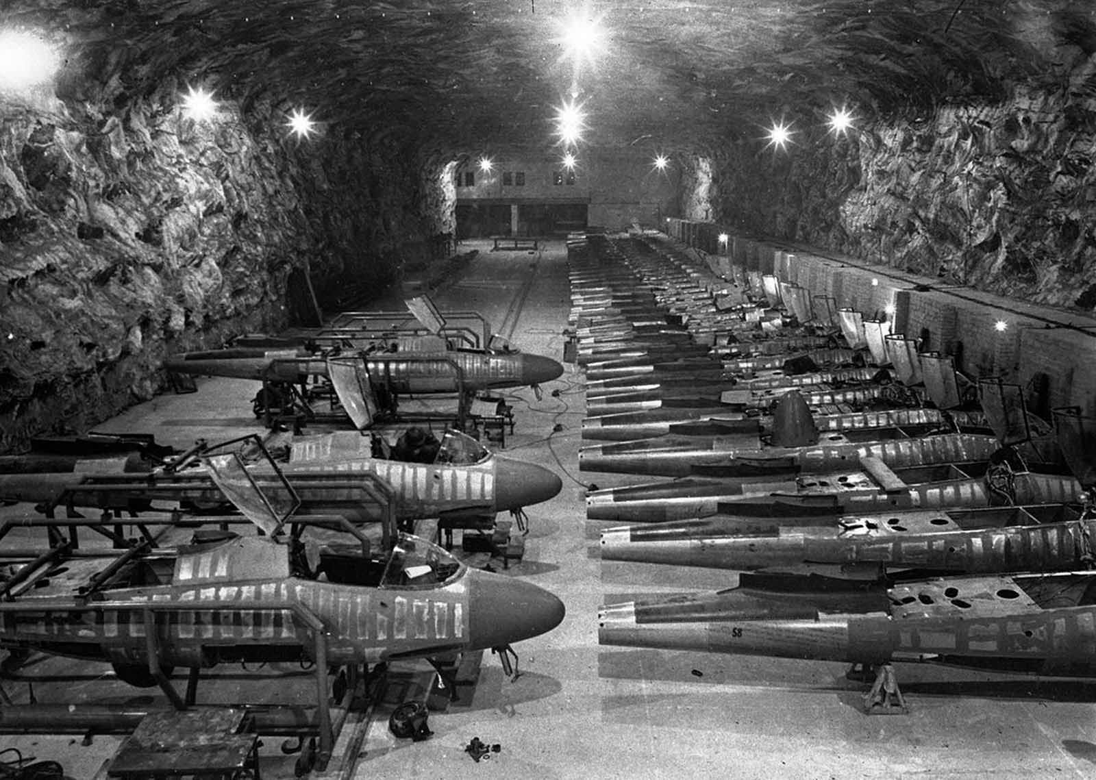 Partly completed Heinkel He-162 fighter jets sit on the assembly line in the underground Junkers factory at Tarthun, Germany, in early April 1945. The huge underground galleries, in a former salt mine, were discovered by the 1st U.S. Army during their advance on Magdeburg.