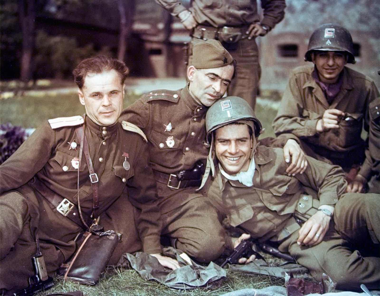 Soviet officers and U.S. soldiers during a friendly meeting on the Elbe River in April of 1945.