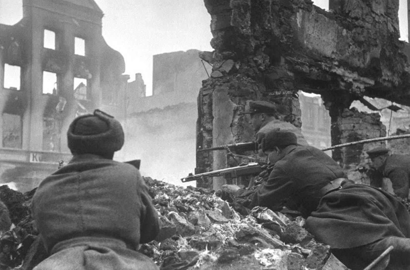 Soviet soldiers lead house-to-house fighting in the outskirts of Königsberg, East Prussia, Germany, in April of 1945.
