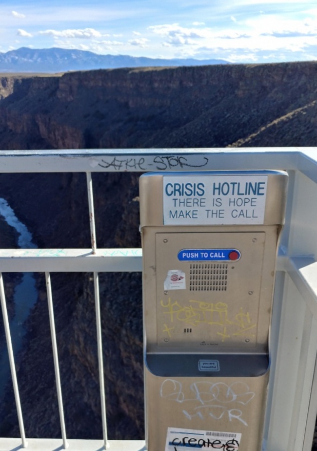 This bridge has a crisis hotline machine.