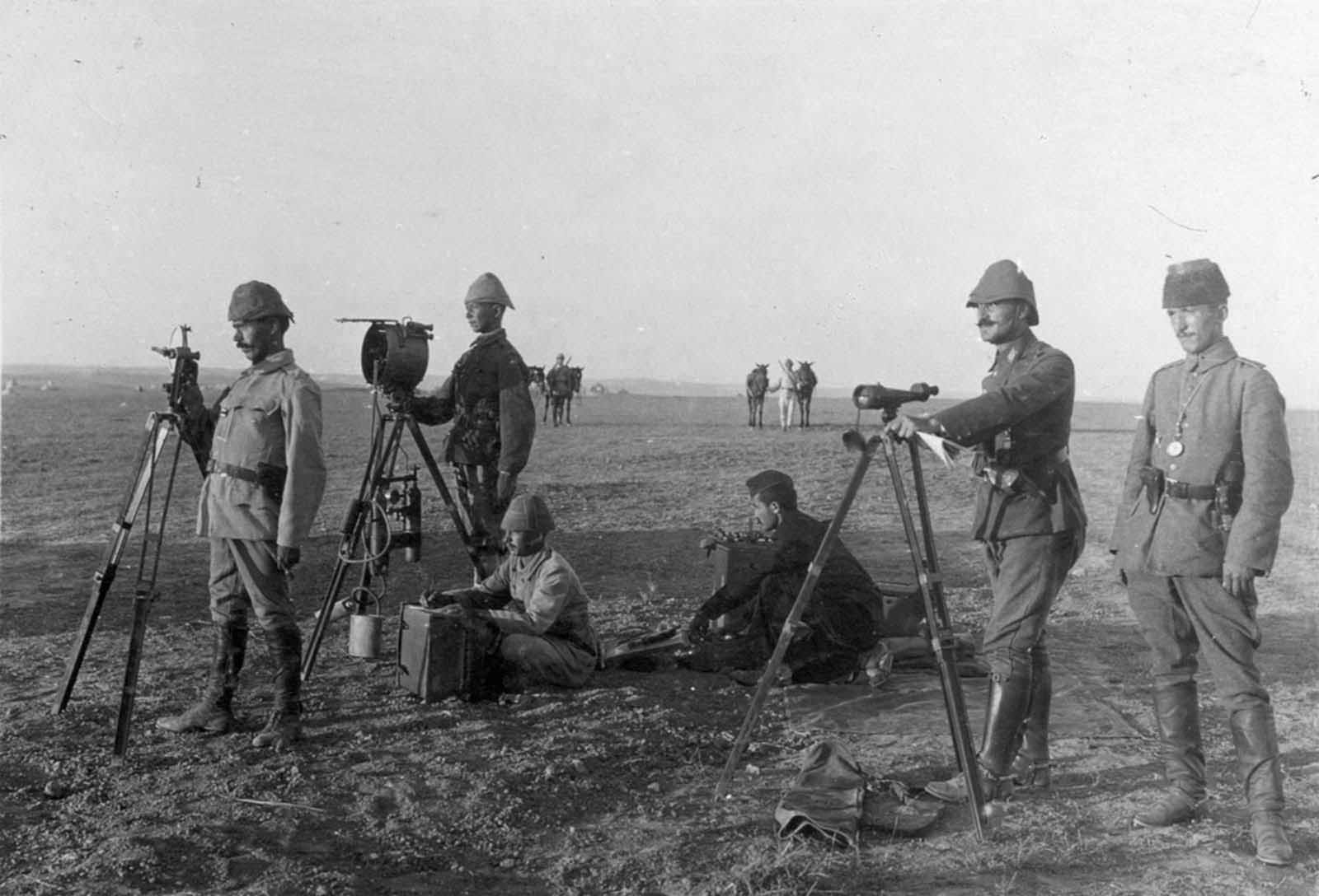 Turkish troops use a heliograph at Huj, near Aza City, in 1917. A heliograph is a wireless solar telegraph that signals by flashes of sunlight usually using Morse code, reflected by a mirror.