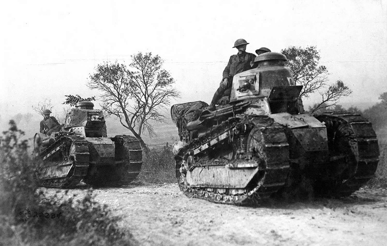 American troops aboard French-built Renault FT-17 tanks head for the front line in the Forest of Argonne, France, on September 26, 1918