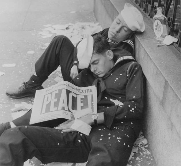 Two sailors passed out from celebrating the end of World War II, 1945.