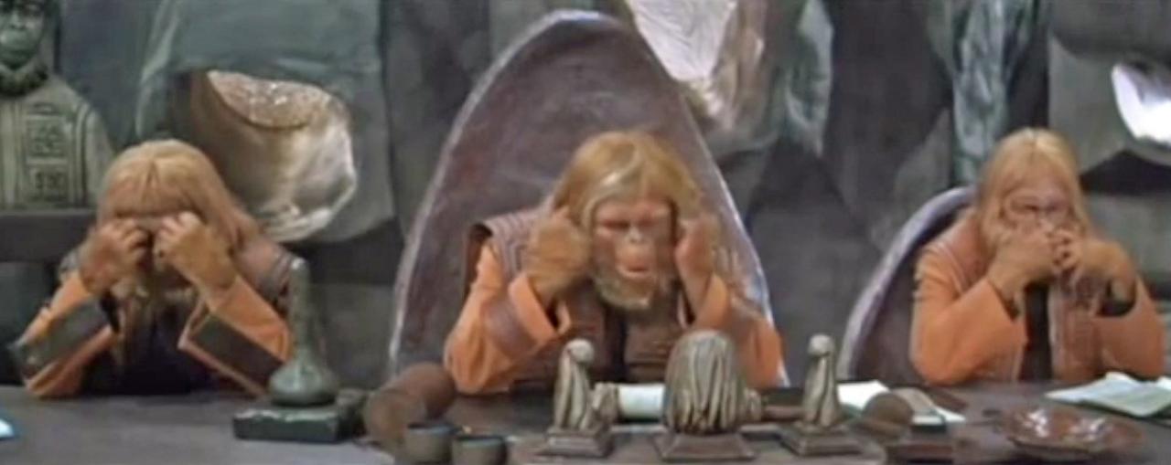 The original 1968 “Planet of the Apes” has the three apes on the Ruling Council “see no evil, hear no evil, and say no evil,” thus reenacting the “Three Wise Monkeys” pose.
