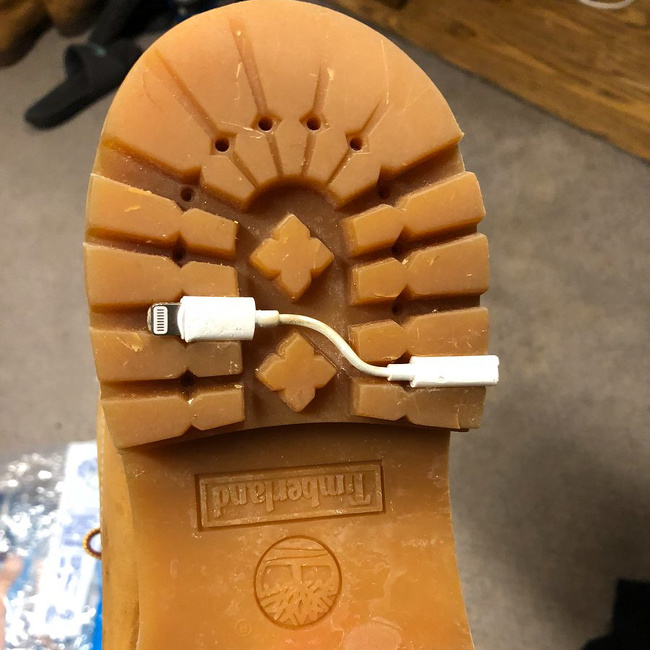 headphone stuck on the bottom of a shoe