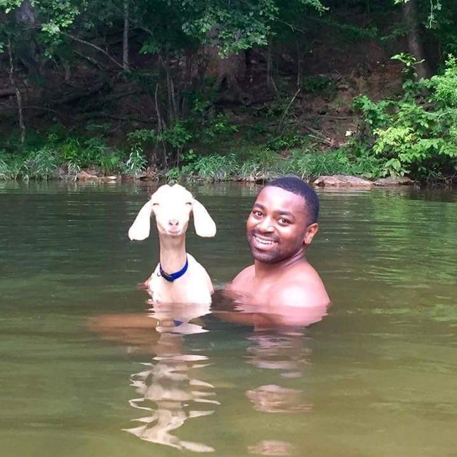 black guy with goat