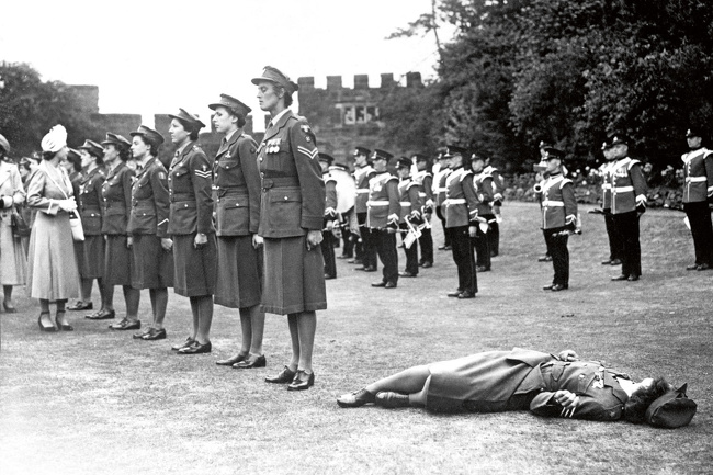 Princess Elizabeth inspects a guard of honor by the Women’s Royal Army Corps at the Royal Agricultural Society’s show in Shrewsbury, England, 1949.