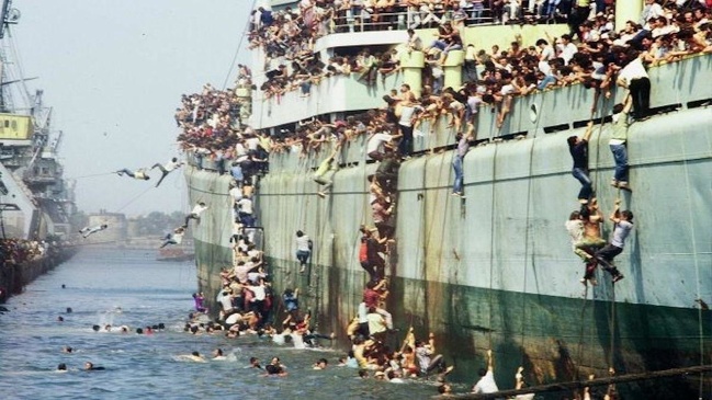 Albanian refugees disembarking in the Italian port of Bari on August 8, 1991.