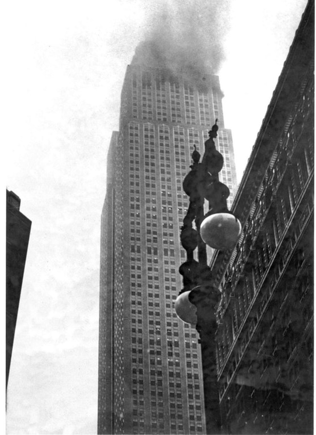 The Empire State Building ablaze after a B-25 bomber crashed into it in thick fog over New York City on July 28, 1945.