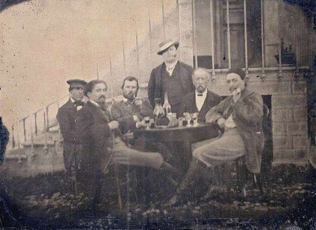 Vincent van Gogh (third from the left) and Paul Gauguin (far right) drinking in the company of fellow post-impressionist painters. Paris, 1887.