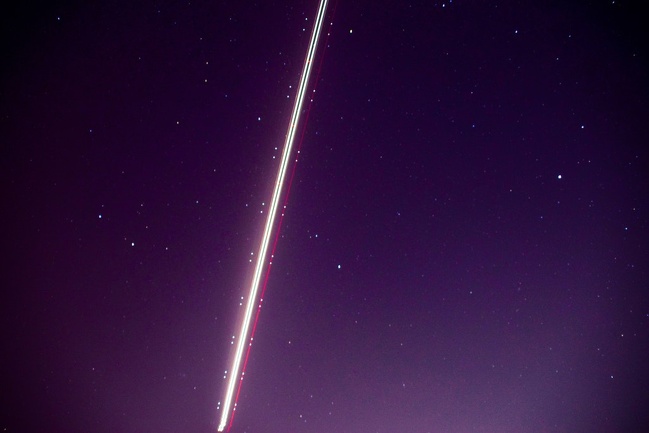“Was trying to take a long exposure shot of the stars when an airplane decided to cut through my frame.”